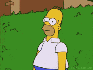A Cartoon Of Homer Simpson Standing In A Grassy Yard GIF