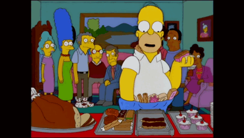 A Cartoon Of Homer Simpson Standing In Front Of A Table Full Of Desserts GIF