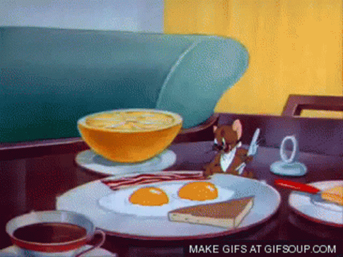 A Cartoon Of Jerry Eating Breakfast With Eggs Bacon And Coffee GIF