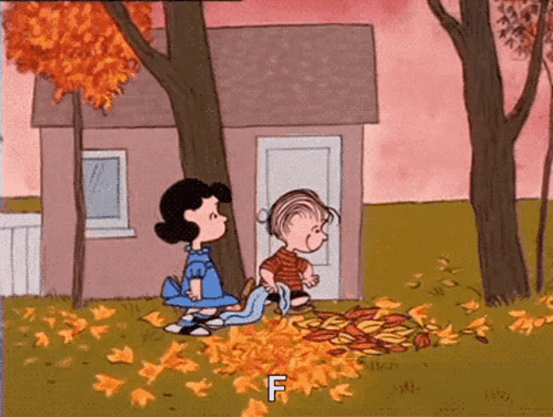 A Cartoon Of Lucy And Linus Peanuts Playing With Leaves In Front Of A House . GIF