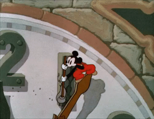 A Cartoon Of Mickey Mouse Cleaning A Clock With The Number 2 GIF
