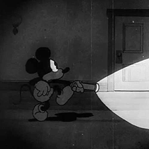 A Cartoon Of Mickey Mouse Holding A Flashlight GIF