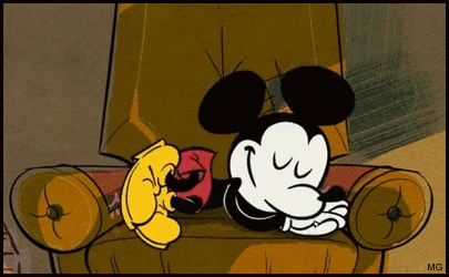 A Cartoon Of Mickey Mouse Sleeping In A Chair With Mg Written On The Bottom GIF