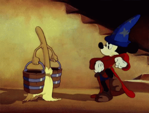 a cartoon of mickey mouse standing next to a bucket and a broom