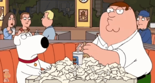 Peter Griffin Sitting At Table With Papers GIF