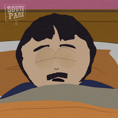 A Cartoon Of Randy Marsh From South Park Laying In Bed GIF
