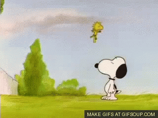 A Cartoon Of Snoopy And Woodstock Standing In A Grassy Field With Trees In The Background .. GIF
