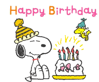 a cartoon of snoopy blowing out candles next to a birthday cake