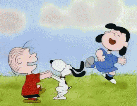 A Cartoon Of Snoopy , Lucy And Linus Playing With A Dog GIF