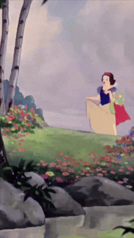 A Cartoon Of Snow White Standing In A Field With Flowers GIF