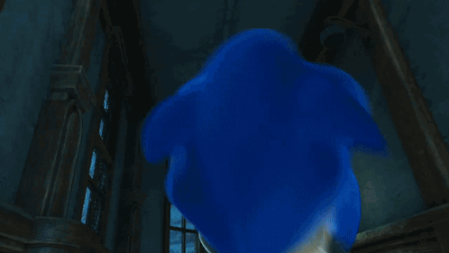 A Cartoon Of Sonic The Hedgehog Standing In A Room GIF