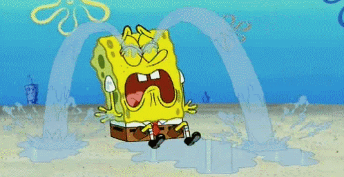 A Cartoon Of Spongebob Squarepants Crying In The Sand GIF