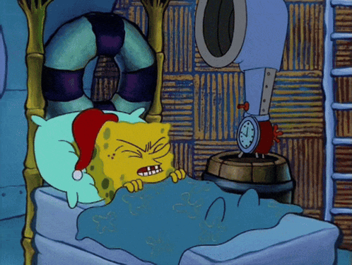 A Cartoon Of Spongebob Wearing A Santa Hat Laying In A Bed GIF