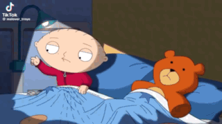A Cartoon Of Stewie From Family Guy Laying In Bed Next To A Teddy Bear GIF