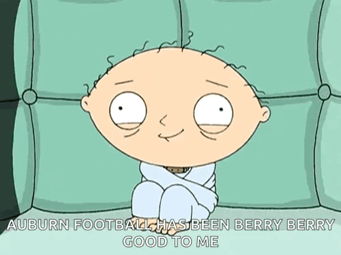 a cartoon of stewie sitting on a couch with the caption auburn football has been berry berry good to me