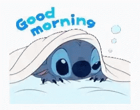 A Cartoon Of Stitch Peeking Out From Under A Blanket With The Words `` Good Morning '' . GIF