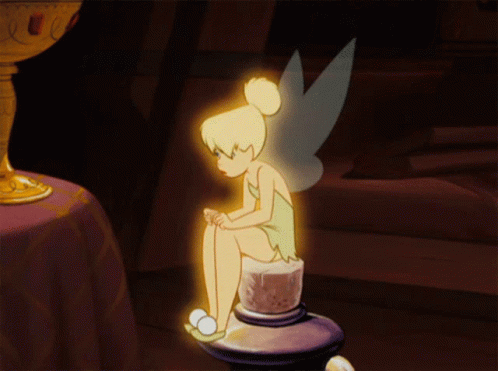 A Cartoon Of Tinkerbell Sitting On A Candle Holder GIF
