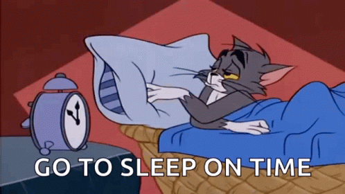 A Cartoon Of Tom And Jerry Laying In Bed With An Alarm Clock Behind Them . GIF