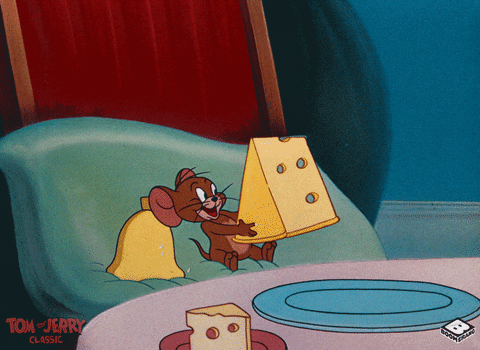A Cartoon Of Tom And Jerry Sitting At A Table Holding A Piece Of Cheese GIF