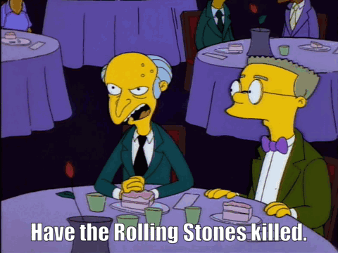 A Cartoon Of Two Men Sitting At A Table With The Words Have The Rolling Stones Killed Below Them GIF