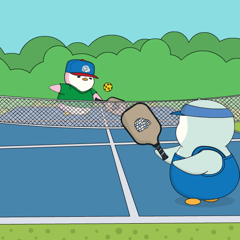 A Cartoon Of Two Penguins Playing A Game Of Tennis GIF