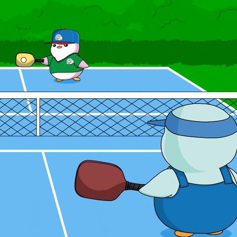 A Cartoon Of Two Penguins Playing Tennis With One Wearing A Shirt That Says ' Penguin ' On It GIF