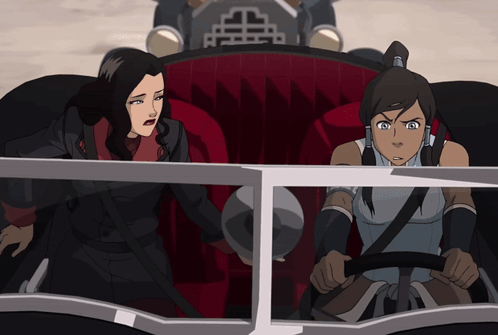 A Cartoon Of Two Women In A Car With A Chinese Symbol On The Side GIF