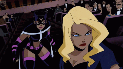 A Cartoon Of Two Women Standing Next To Each Other With The Word Fm On The Bottom Right GIF