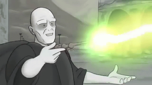 A Cartoon Of Voldemort From Harry Potter Is Pointing At A Green Light . GIF