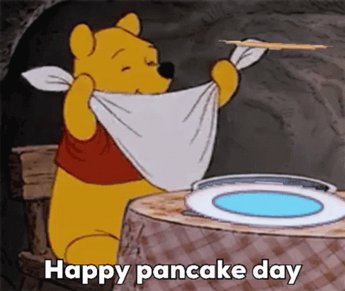 A Cartoon Of Winnie The Pooh Holding A Towel Around His Neck While Holding A Pancake . GIF