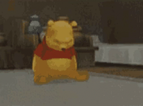 A Cartoon Of Winnie The Pooh Standing On A Carpet GIF