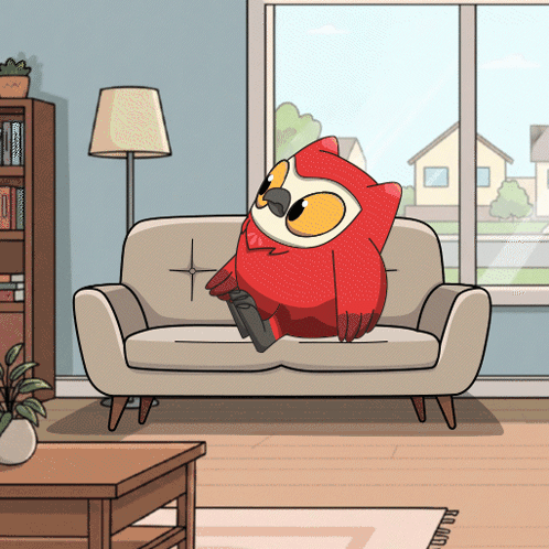 A Cartoon Owl Is Sitting On A Couch In A Living Room GIF