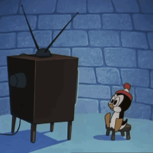 A Cartoon Penguin Is Sitting On A Stool Watching A Tv GIF
