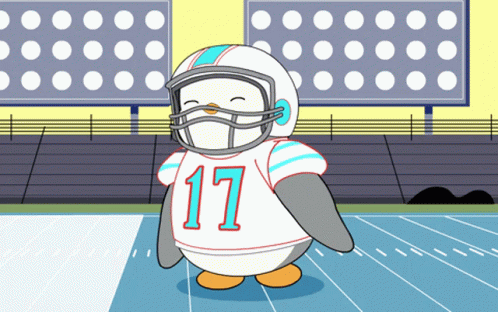 A Cartoon Penguin Wearing A Football Uniform With The Number 17 GIF