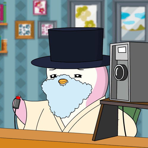 A Cartoon Penguin With A Top Hat And A Beard GIF
