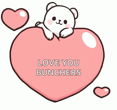 A Cartoon Polar Bear Is Sitting On Top Of A Pink Heart . GIF