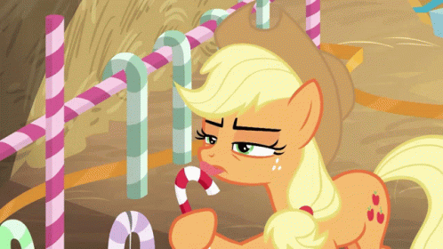 A Cartoon Pony Is Holding A Candy Cane In Its Mouth GIF