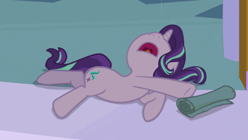 A Cartoon Pony Is Laying On The Floor With Its Mouth Wide Open GIF