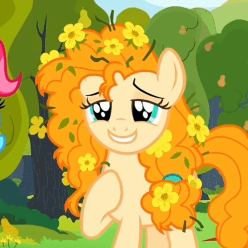 A Cartoon Pony With Orange Hair And Yellow Flowers On It GIF