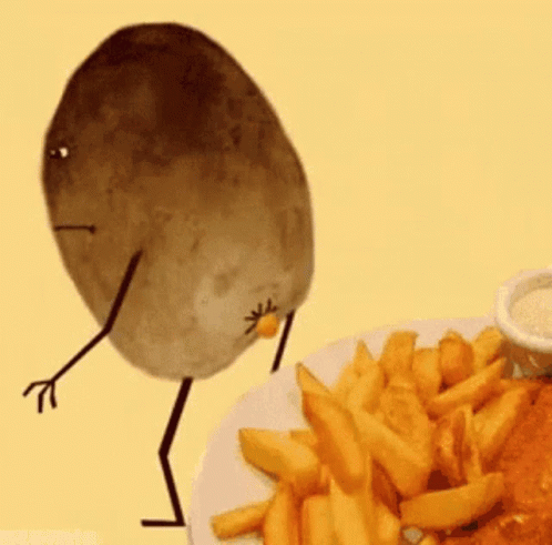 A Cartoon Potato With Arms And Legs Is Standing Next To A Plate Of French Fries . GIF