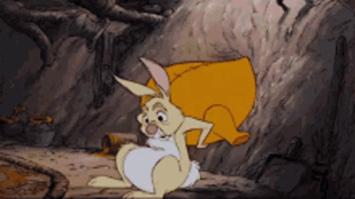 A Cartoon Rabbit Is Sitting On A Rock With A Yellow Pillow On Its Back GIF