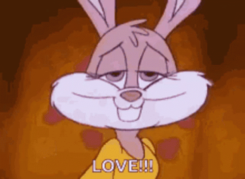 A Cartoon Rabbit Is Smiling And Says Love . GIF