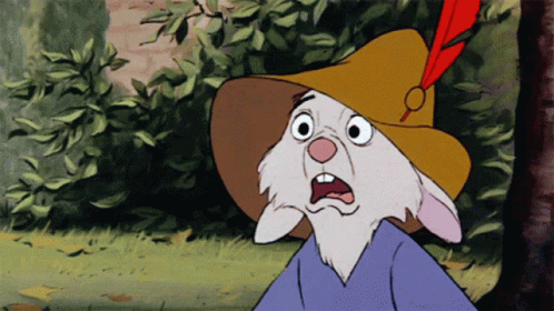 A Cartoon Rabbit Wearing A Yellow Hat With A Red Feather On Top GIF