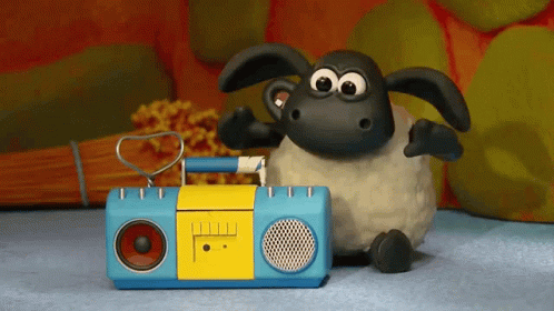 A Cartoon Sheep Is Sitting Next To A Blue And Yellow Radio GIF