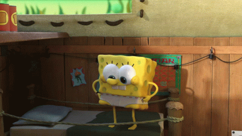 A Cartoon Spongebob Is Standing On A Bed In A Room GIF