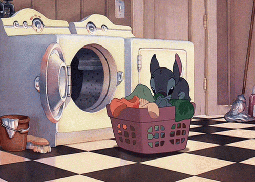 A Cartoon Stitch Is Sitting In A Laundry Basket GIF
