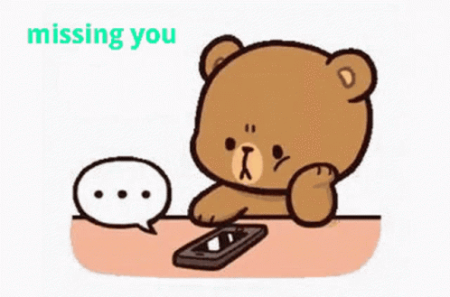 A Cartoon Teddy Bear Is Sitting At A Table With A Cell Phone And A Speech Bubble . GIF