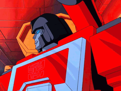 A Cartoon Transformer Is Waving His Hand In Front Of A Computer Screen GIF