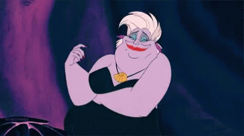A Cartoon Ursula From The Little Mermaid Is Smiling And Making A Face . GIF