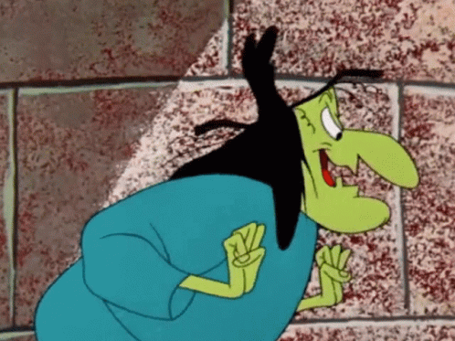 A Cartoon Witch With A Long Black Hair And A Large Nose GIF